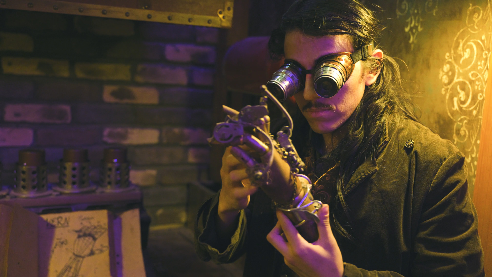 A steampunk man holding a robotic hand